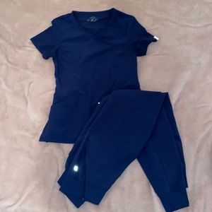 Cherokee Infinity navy blue jogger scrub pants and two-pocket scrub top size XS